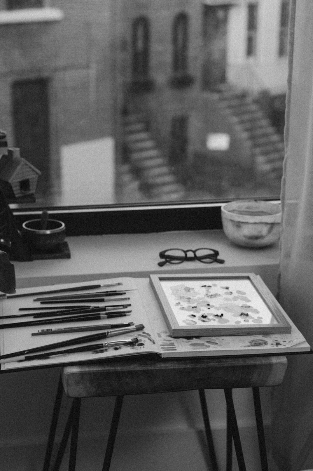 Desk with documents, a laptop and a magnifying glass used for research