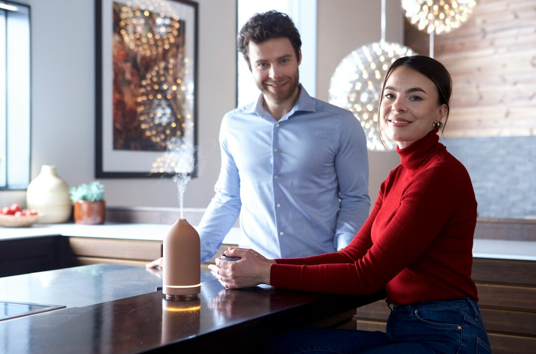 Two professionals having a serious conversation across a table